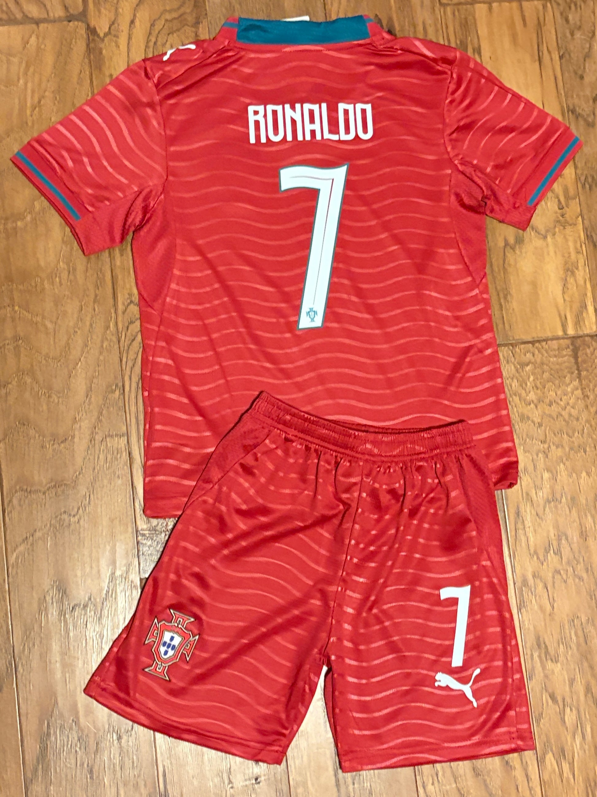 Cristiano RonaldoPortugal red home youth soccer jersey kit, two-piece set. 22 XS, 24 Small, 26 Medium, 28 Large. 